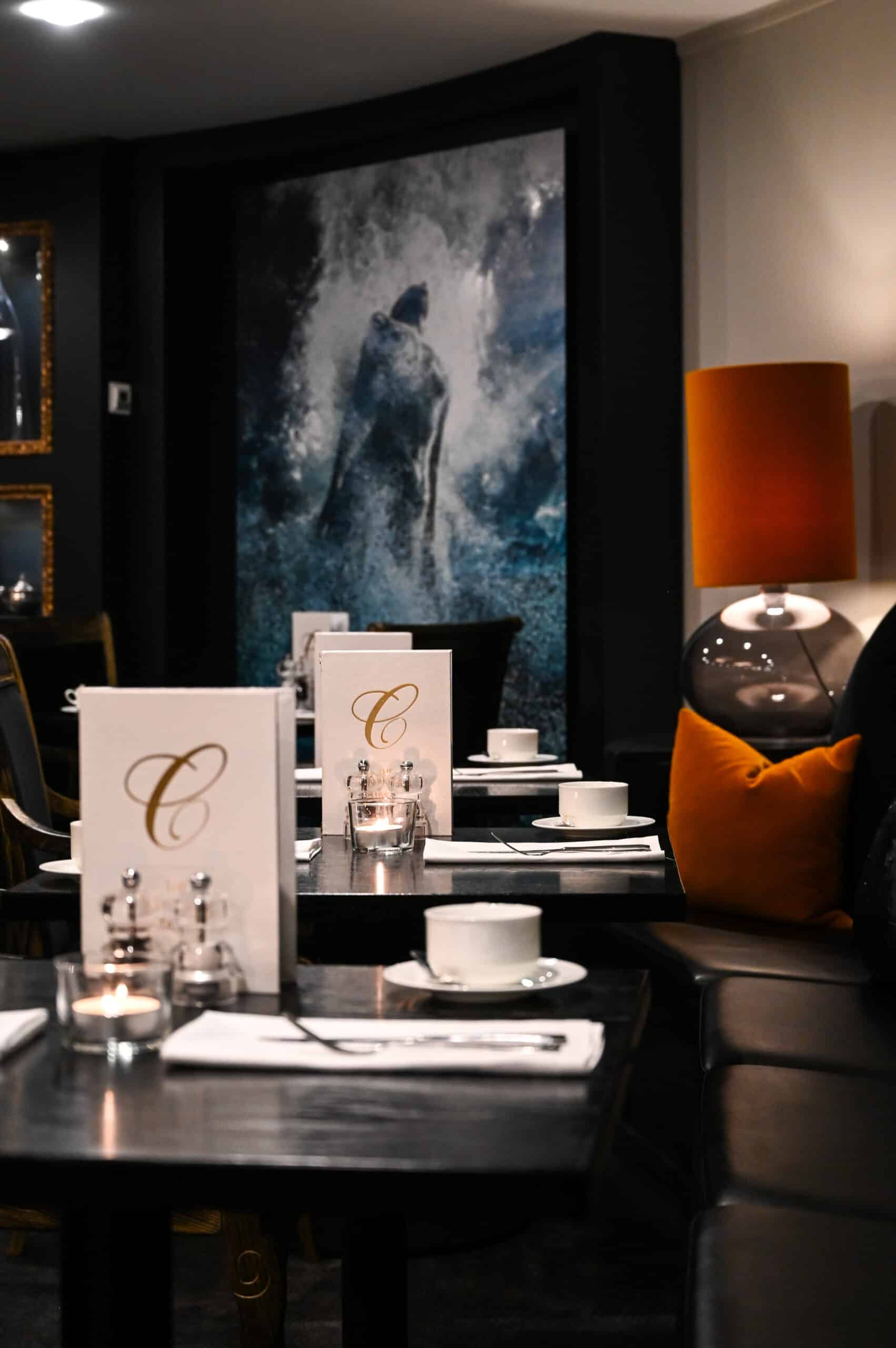 Elegant breakfast restaurant with modern decor and artwork.